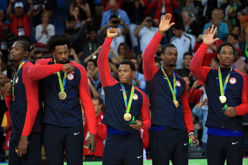 Kevin Durant #5, DeAndre Jordan #6, Kyle Lowry #7, Harrison Barnes #8 and DeMar DeRozan #9 of the USA celebrate after winning