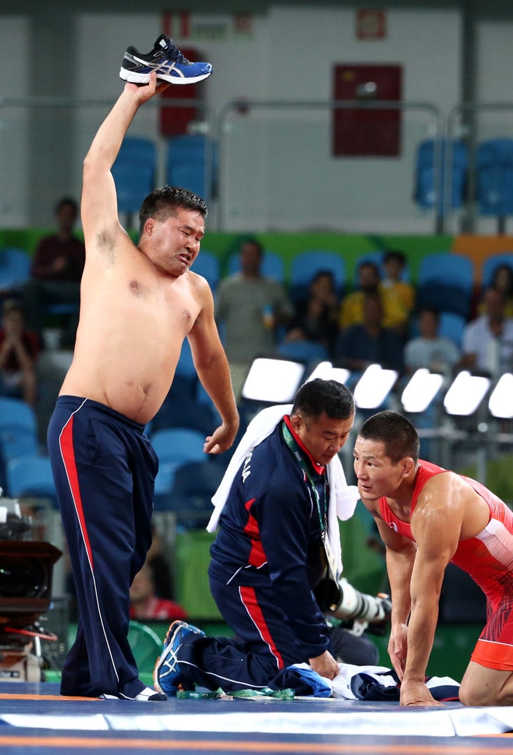 Mongolian Wrestling Coaches Strip To Protest Olympic Judges' Decision