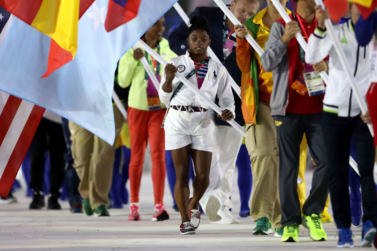 Simone Biles of United States walks during the "Heroes of the Games" segment during the Closing Ceremony on Day 16 of the Rio 2016 Olympic Games.