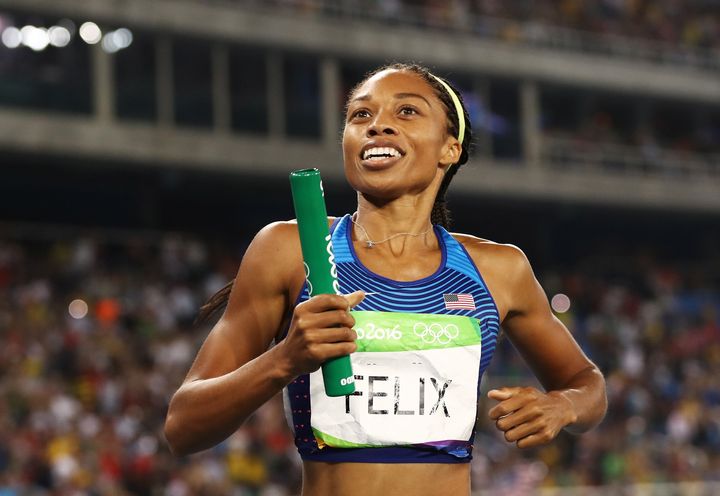 Allyson Felix reacts after winning gold during the Women's 4 x 400 meter Relay