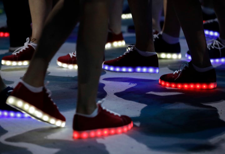 <strong>British athletes wear disco shoes during the closing ceremony.</strong>