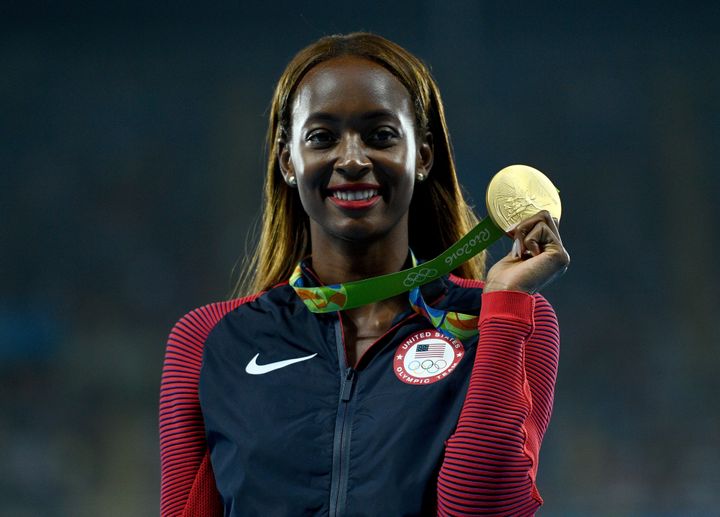 Gold medalist, Dalilah Muhammad of the United States, poses on the podium during the medal ceremony.