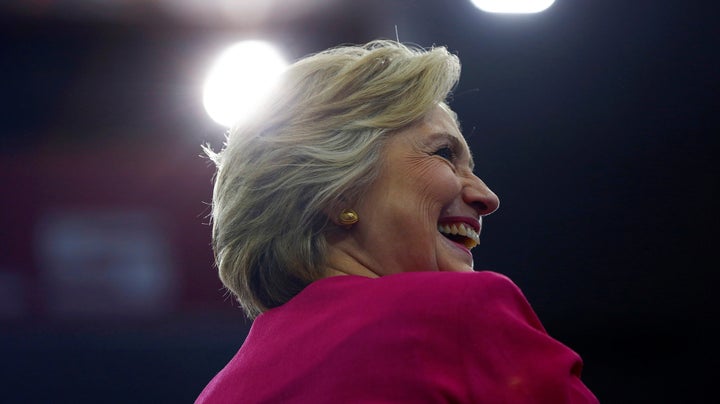 "I see you making the drive to a clinic 200 miles away," Clinton writes in a recent essay. "I see you dropping your daughter