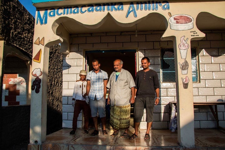 Yemeni business owners stand in front of their shop in Hargeisa. Yemeni migrants have been traveling to Somaliland for work o