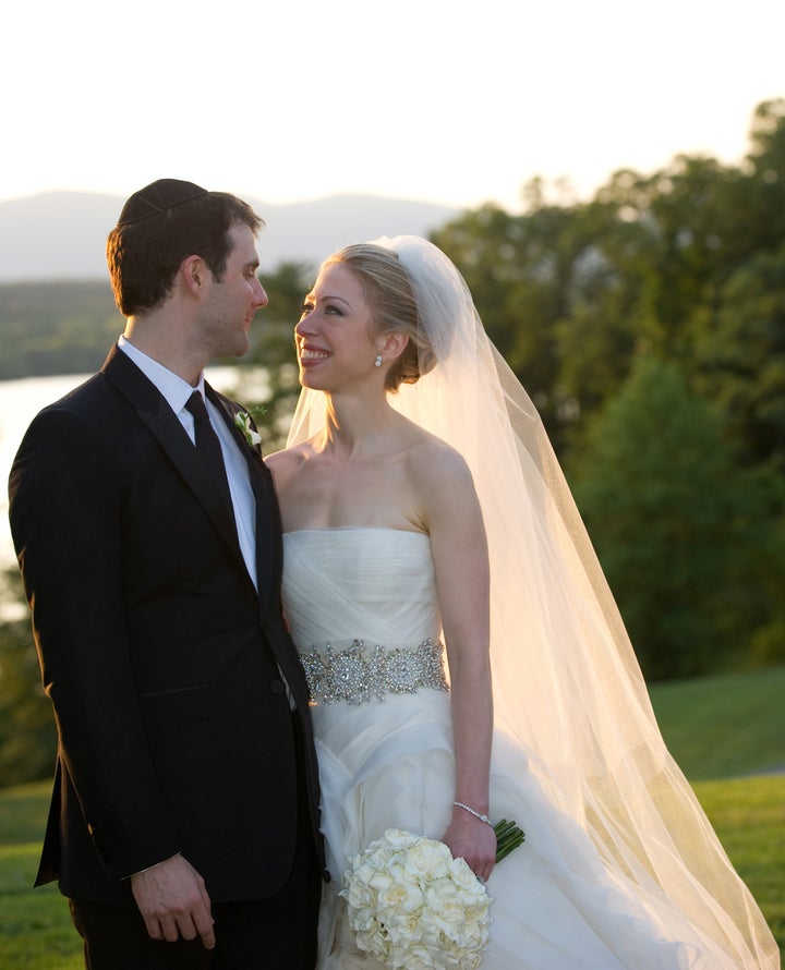 Clinton's ceremony dress featured a strapless bodice and a voluminous organza ball gown skirt.