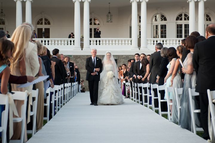 The bride's father, former President Bill Clinton, walked her down the aisle at the venue in Rhinebeck, New York.