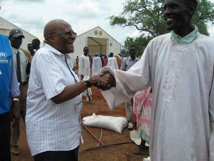 Archbishop Desmond Tutu greets a refugee in a Yusuf Batil camp in Southern Sudan. Photo/Adriane Ohanesian