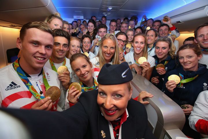 <strong>Gold medalists of Team GB pose for a selfie with a member of British Airways cabin crew,</strong>