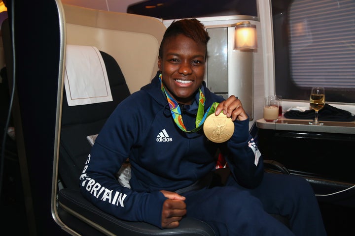 <strong>Nicola Adams of Great Britain poses with her gold medal during the Team GB flight.</strong>