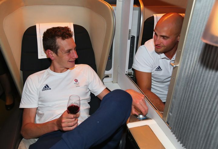 <strong>Alistair Brownlee (L) and Liam Heath of Great Britain chat during the Team GB flight back from Rio.</strong>