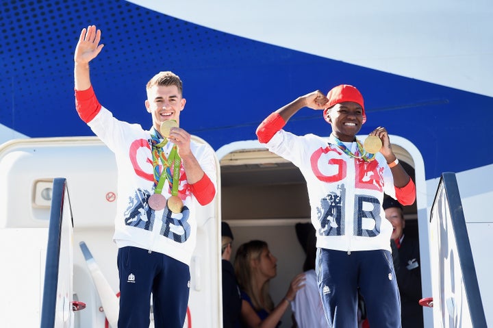 <strong>Team GB Gymnast and gold medallist Max Whitlock (L) with fellow gold medallist and boxer Nicola Adams at Heathrow.</strong>