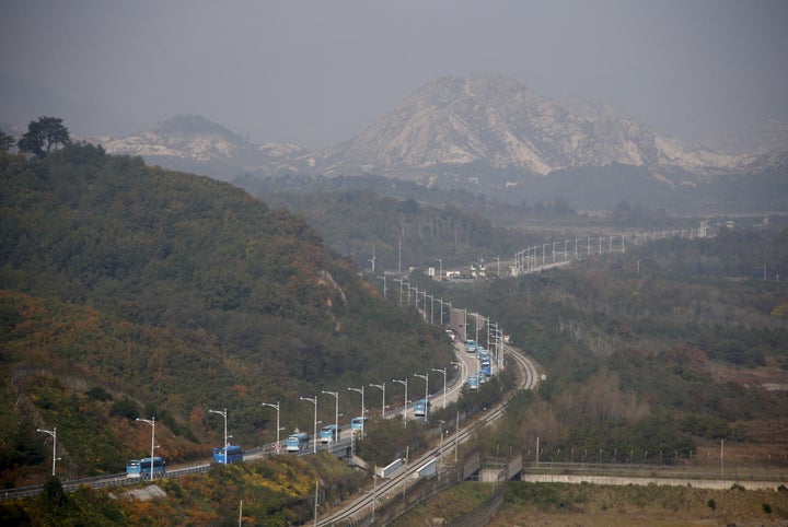 Buses transporting South Korean participants for a reunion travel on the road leading to North Korea's Mount Kumgang resort, in the demilitarized zone (DMZ) separating the two Koreas.