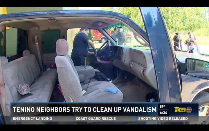 Local firefighter Mike Vanderhoof is seen replacing a door panel on a vandalized truck belonging to the family.