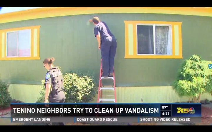 Volunteers, including a local police officer and firefighter, were seen joining in the cleaning efforts.
