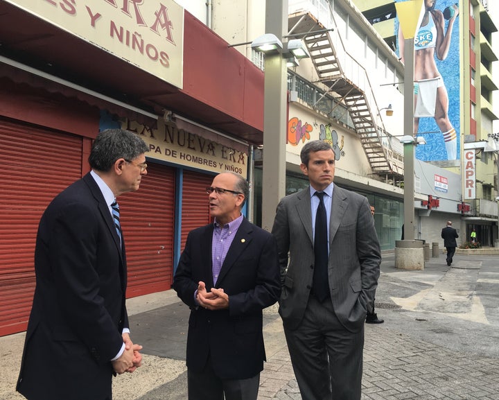 Antonio Weiss, at right, stands by as Treasury Secretary Jack Lew talks to the president of Puerto Rico’s Chamber of Commerce, José Vazquez Barquet, in San Juan, Puerto Rico.