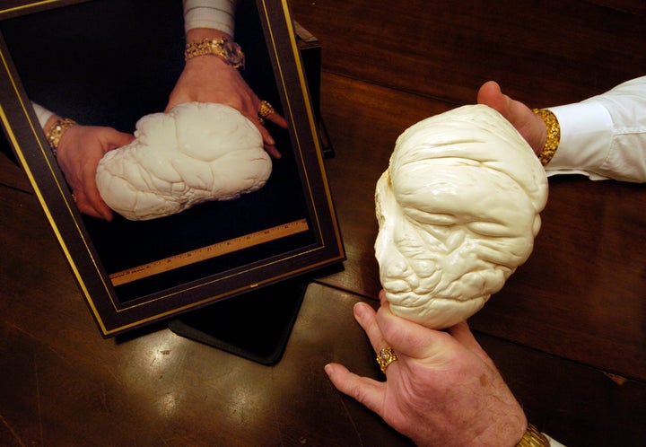 A replica of the Pearl of Lao-Tse, or Pearl of Allah, demonstrates its relative size compared to another huge pearl