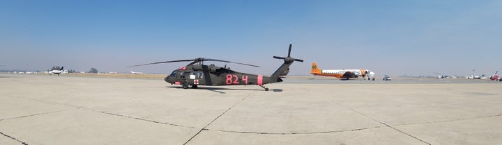 UH-60 MEDEVAC helicopter and air tanker on the ground in Paso Robles