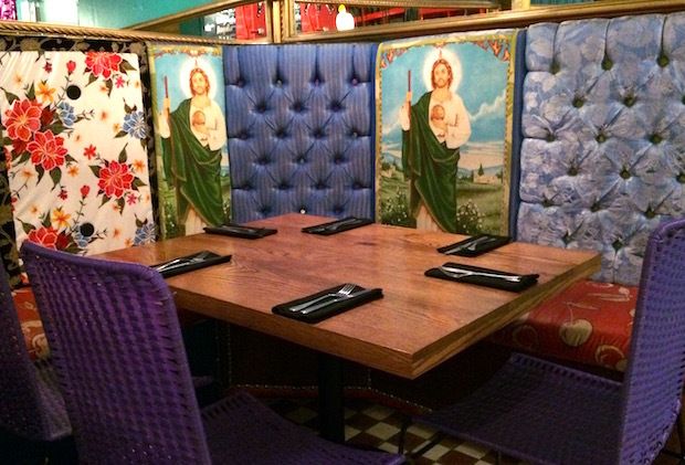 Kitschy religious decorations set the stage for tasty Mexican specialties at I Latina restaurant in Guadalajara, Mexico. 