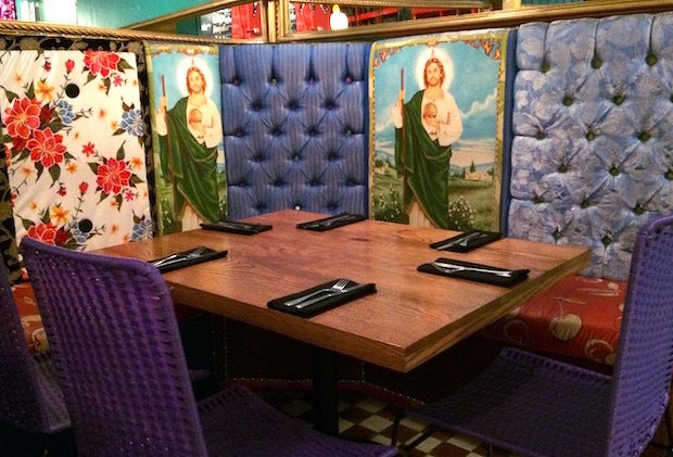 Kitschy religious decorations set the stage for tasty Mexican specialties at I Latina restaurant in Guadalajara, Mexico. 