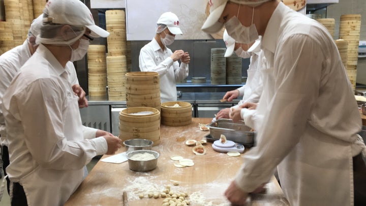 You can watch workers make the dumplings through a window.