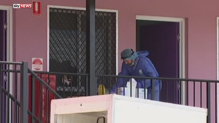 A police forensics officer examines the scene of the stabbing in Queensland