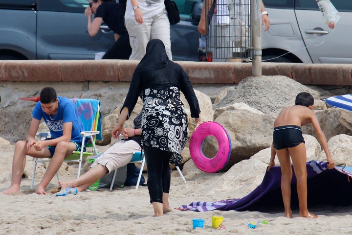 A burkini-clad woman on the beach in Marseille, France.