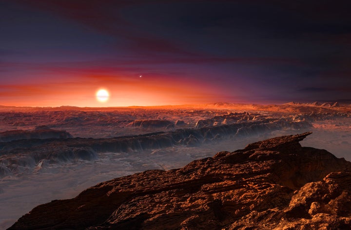 Artist's impression shows a view of the surface of planet Proxima b orbiting the red dwarf star Proxima Centauri, the closest star to our solar system. The double star Alpha Centauri can also be seen to the upper right of Proxima Centauri.