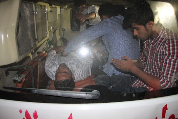 A wounded person receives treatment in an ambulance near the site of an explosion that targeted American University.