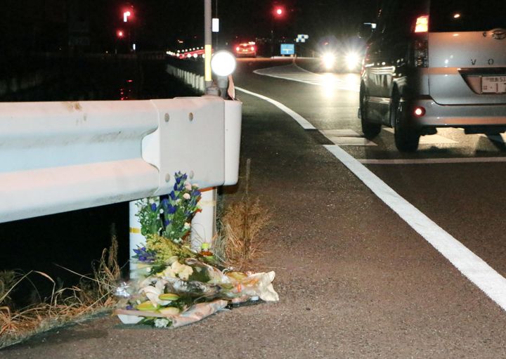 Flowers are laid near the scene where a passer-by was killed after being hit by a driver who was allegedly playing "Pokemon Go" while driving in Tokushima, Japan.