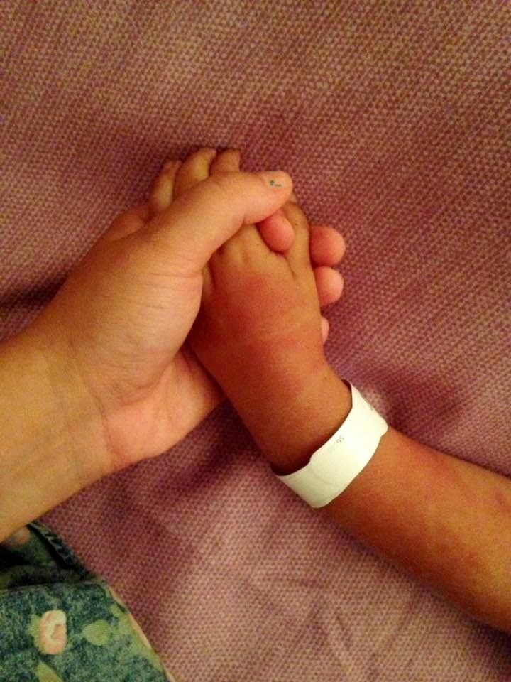 Jasmine Shortland holding her son's hand.