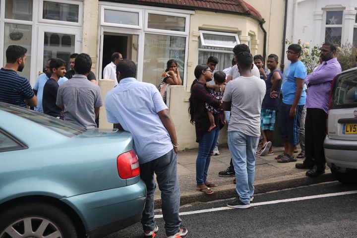 Grieving family and friends gather outside Ravi's home in Woolwich, south east London