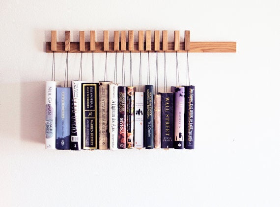 <i><a href="https://www.etsy.com/listing/152017152/custom-made-wooden-book-rack-bookshelf" target="_blank">image source: etsy