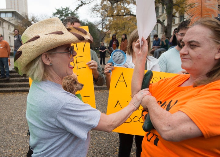 Two women clash over a sex toy at a previous protest in the spring 2016 semester, as groups in favor and opposed to guns allowed anywhere on Texas college campuses clashed Saturday drawing fewer than 200 people.