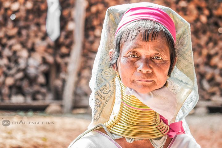 Padaung woman wearing a set of 24 brass coils