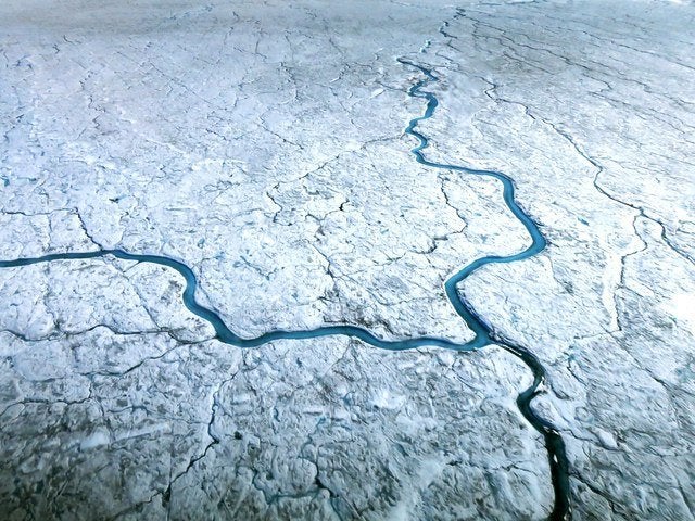 Greenland loses ice to the sea mainly through two processes the shedding of icebergs from glaciers that run into the sea and surface melt runoff