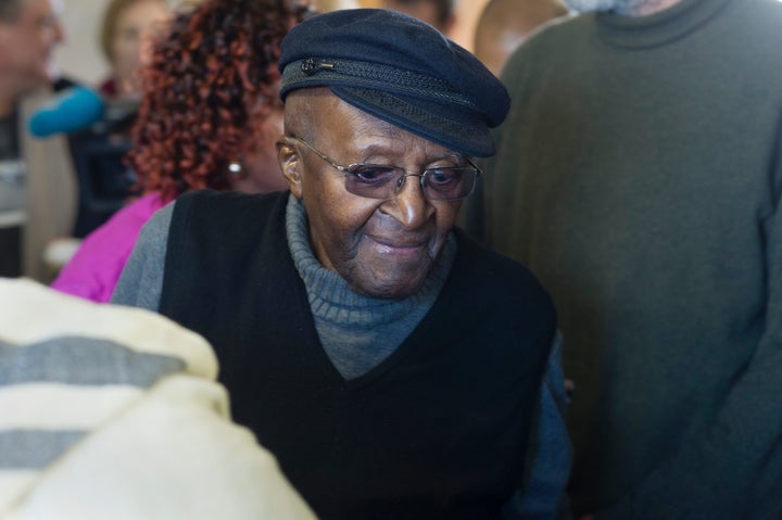 South African anti-apartheid activist and Nobel Peace Laureate Archbishop Desmond Tutu arrives to cast his vote in the South African local government elections in Cape Town on August 3, 2016.