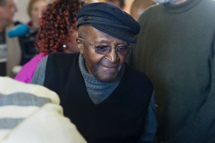 South African anti-apartheid activist and Nobel Peace Laureate Archbishop Desmond Tutu arrives to cast his vote in the South African local government elections in Cape Town on August 3, 2016.
