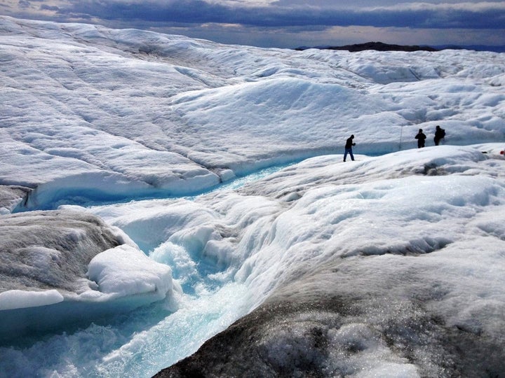 A team from Rutgers University and the University of Georgia measures meltwater runoff from the ice sheet margin in Greenland during summer 2013