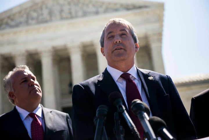 Texas Attorney General Ken Paxton (right) has filed 13 lawsuits against the Obama administration.