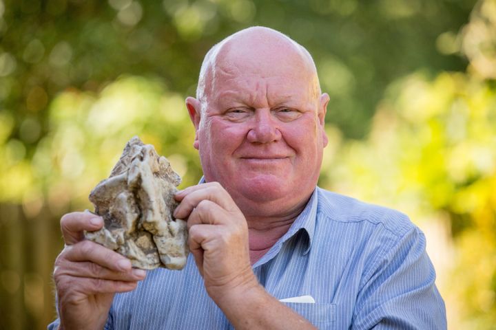 Alan Derrick 67 holds up a piece of whale vomit he found on a beach in Somerset UK. Turns out it could be worth $85,000.