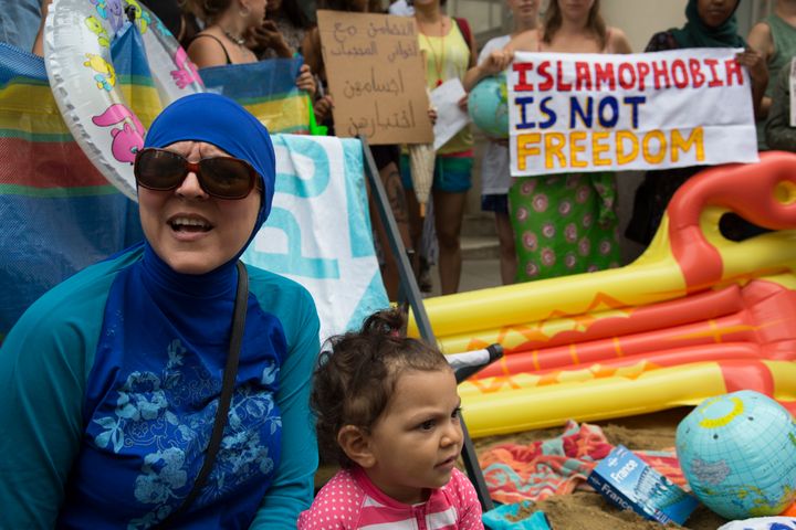 Demonstrators gathered at the French Embassy in London this August to protest France's ban on "burkini" swimsuits.