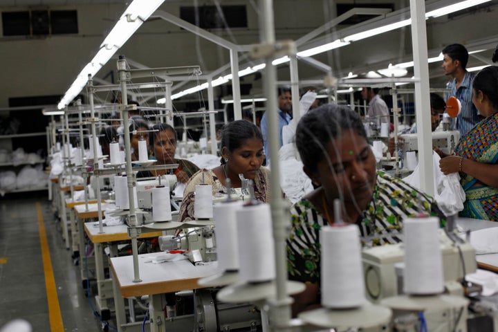 Employees sew clothes at the Estee garment factory in Tirupur, in the southern Indian state of Tamil Nadu June 19, 2013.