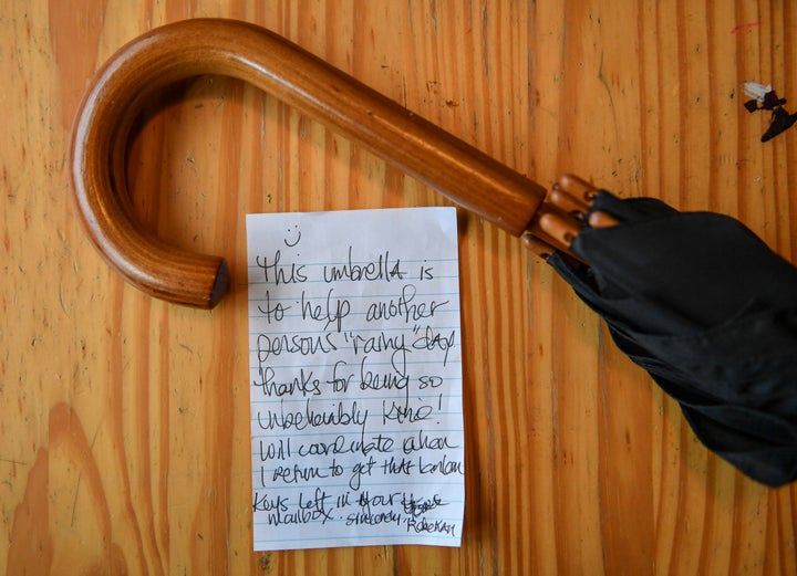 An umbrella and a note left by the last woman who stayed at Arafa's apartment.