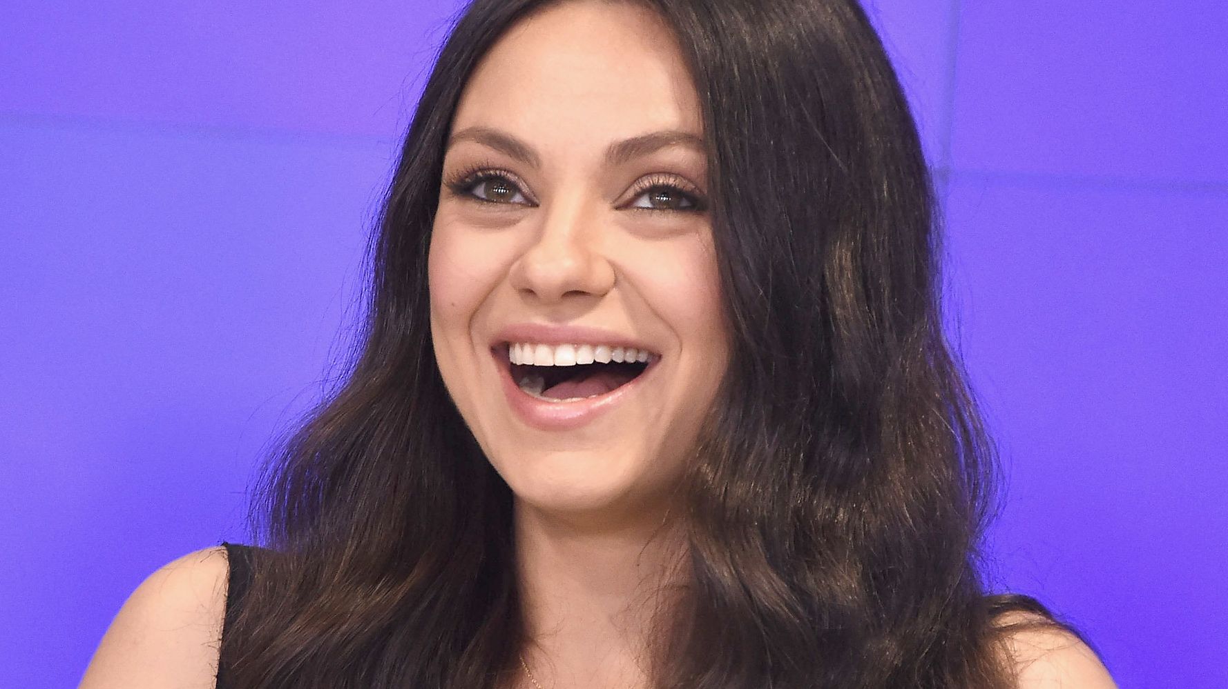 Mila Kunis Is A '70s Goddess Again In This Cozy Throwback Shirtdress ...