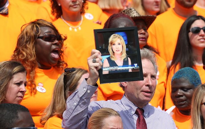 Andy Parker, father of murdered television reporter Alison Parker, holds up her picture during a rally with gun violence survivors, and families, at the U.S. Capitol on July 6.