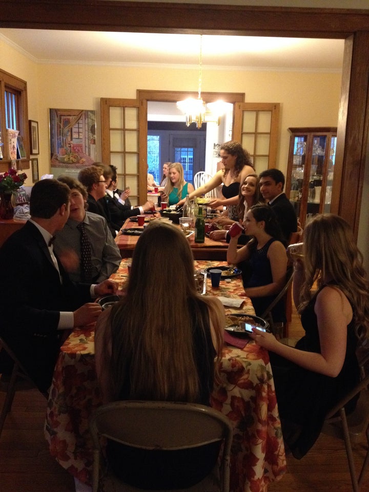 My daughter, and a dozen of her friends, at a dinner held (where else?) at our house before the high school prom in 2015.