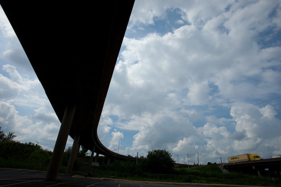 On the ramp to I-64 East at 20th Street. On the left, I-64; on the right, Downtown West neighborhood.