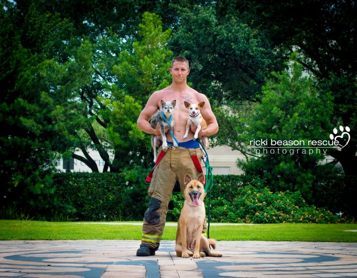 Dustin, Mr. February, posing with Luke and Ackbark from Forgotten Dogs of the 5th Ward.