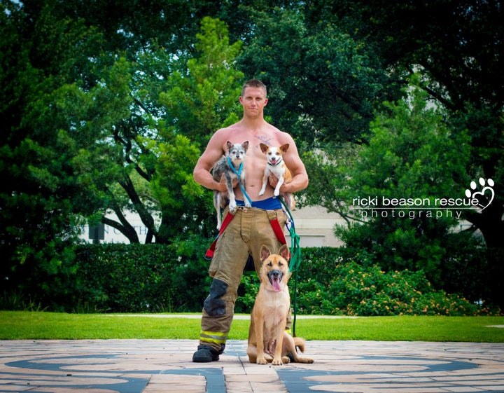 Dustin, Mr. February, posing with Luke and Ackbark from Forgotten Dogs of the 5th Ward. 