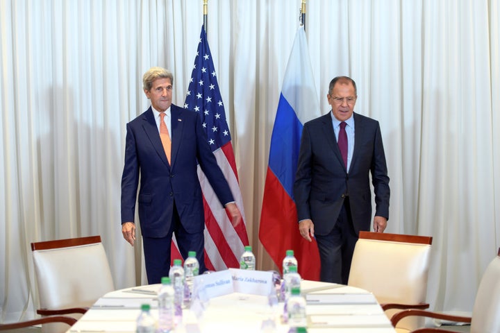 U.S. Secretary of State John Kerry (L) and Russian Foreign Minister Sergei Lavrov (R) before a bilateral meeting focused on t